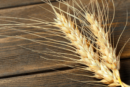 Wheat Ears on the Wooden Table