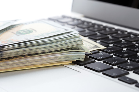 money on laptop