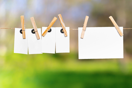 Blank paper notes with copy space pinned on rope の写真素材