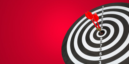 darts arrows in the target centerの写真素材