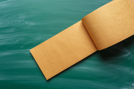 note paper on chalkboard for textの写真素材