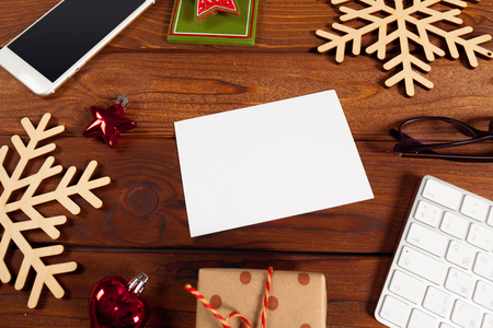 Greeting card and gift box on office tableの写真素材