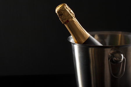Champagne bottle on a black backgroundの写真素材