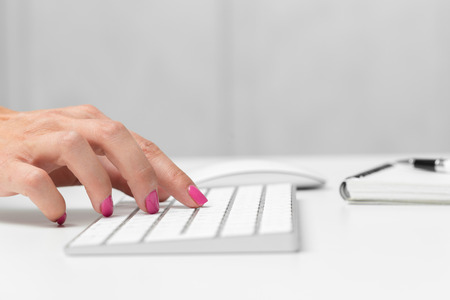 Woman's hands on a keyboard