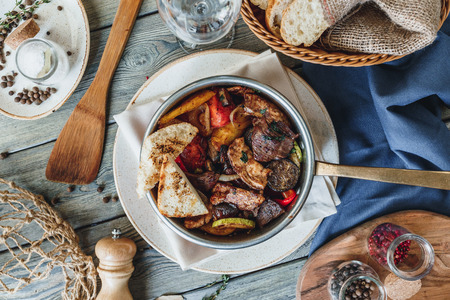 Hot pan  meal with steak and chickenの写真素材