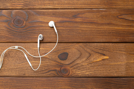 earphones on wooden tableの写真素材