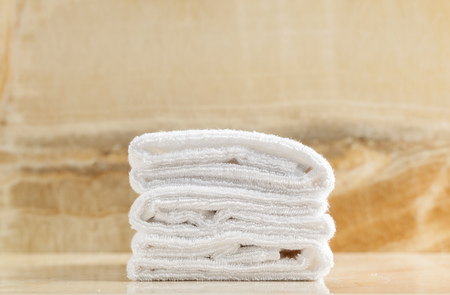 Clean white towel fold in hotel roomの写真素材
