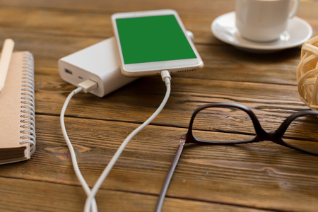 powerbank charging a smartphoneの写真素材