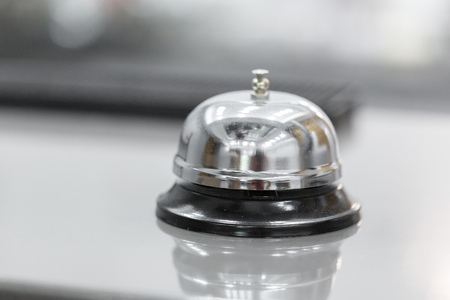 Support and service bell in hotel on blurred background.