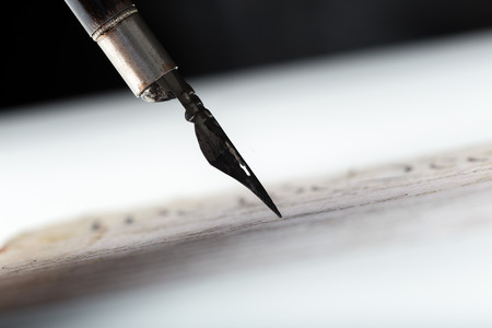 Fountain pen on an antique handwritten letterの写真素材