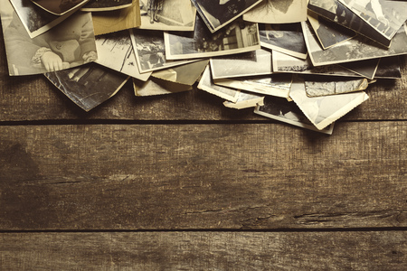 old photos on the wooden tableの写真素材