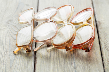 The eyeglasses on wooden table