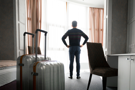 Mature businessman in a hotel roomの写真素材