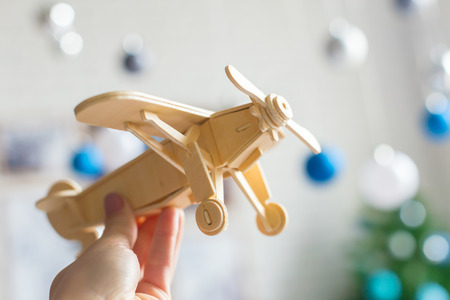 toy airplane in hand