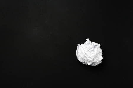 ball of white paper isolated on blackの写真素材