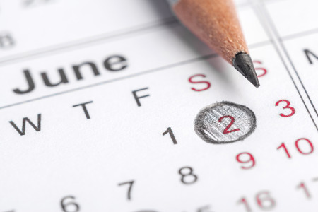 Closeup of dates on calendar pageの写真素材