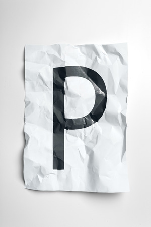 Grunge wrinkled paper letters on white backgroundの写真素材