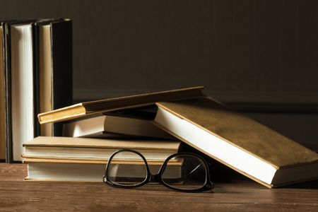 Books close up on old wooden tableの写真素材