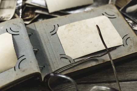 retro some old photos on wooden tableの写真素材