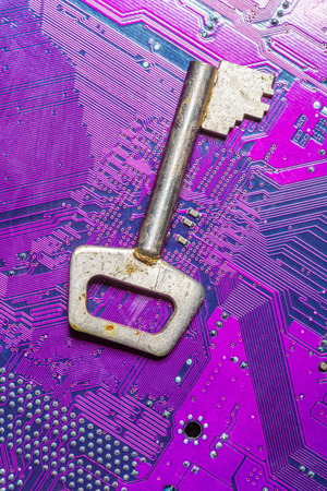 Close up of key on computer circuit boardの写真素材