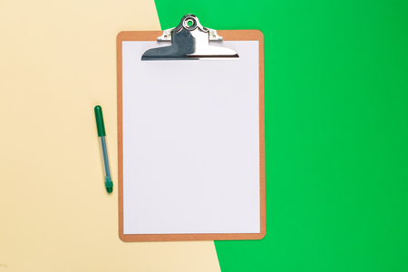Blank paper notepad on bright bicolor background for your design, top viewの写真素材