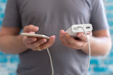 Smartphone charging with power bankの写真素材