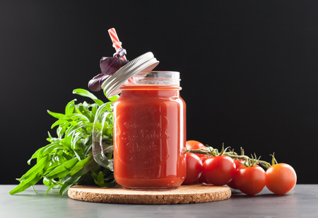 Tomato juice and fresh tomatoesの写真素材