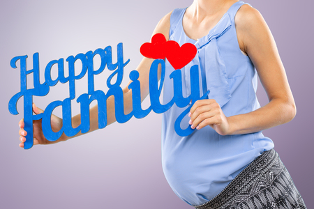 Portrait of the young happy smiling pregnant womanの写真素材