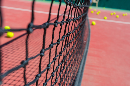 Tennis net on a tennis court backgroundの写真素材