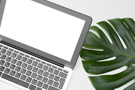 workspace with keyboard, palm leaf and accessories. Flat lay, top view copy spaceの写真素材