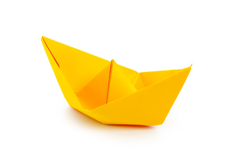 origami paper boat isolated on white backgroundの写真素材