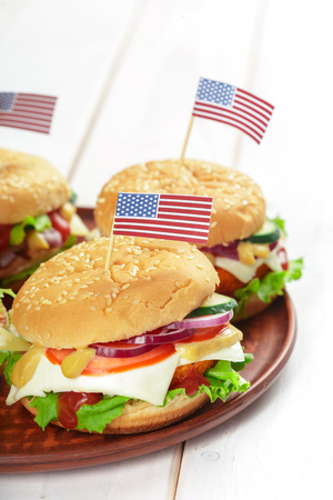 Fast food, homemade burger on a wooden backgroundの写真素材
