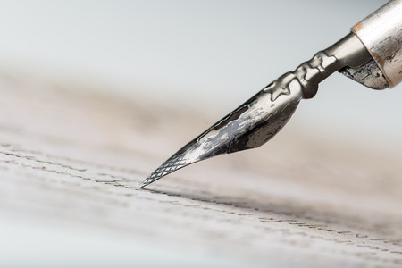 Fountain pen on an antique handwritten letterの写真素材