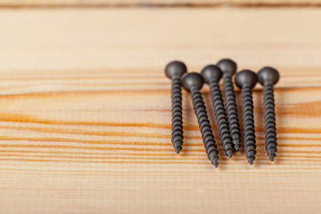 screws on a wooden table