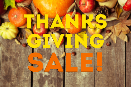 Happy thanksgiving day sale display on wooden backgroundの写真素材
