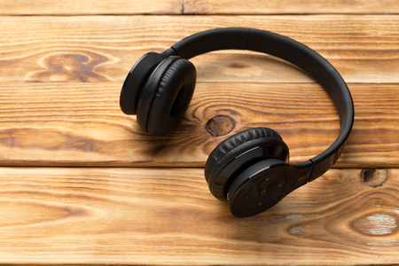 Stereo headphones on wooden backgroundの写真素材