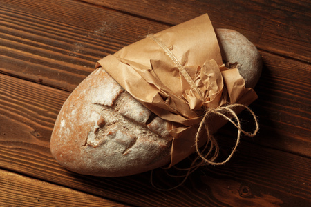 Freshly baked bread on wooden table