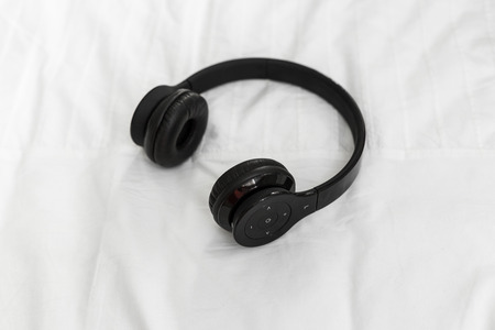 headphone lying on pillow for listening relax musicの写真素材