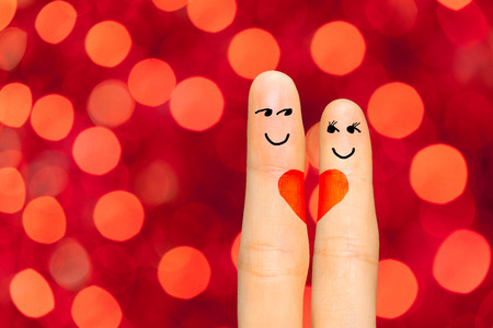 A couple in love. Fingers symbolizing loversの写真素材