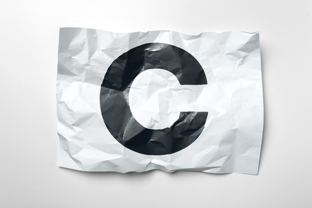 Grunge wrinkled paper letters on white backgroundの写真素材