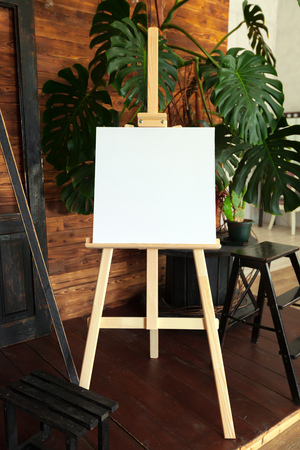 Wooden easel in the roomの写真素材