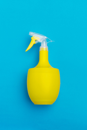 Plastic spray washing bottles with yellow liquidの写真素材