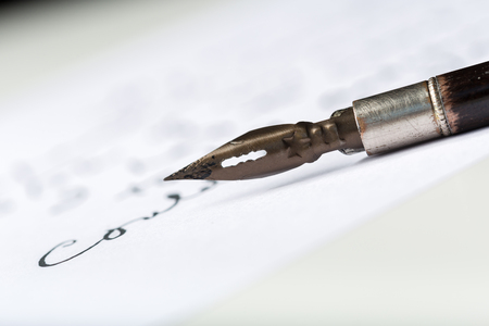 Fountain pen on an antique handwritten letterの写真素材