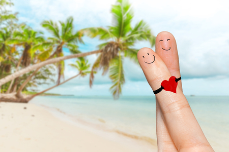 Human hand fingers with funny painted emoticons. People relationships conceptの写真素材