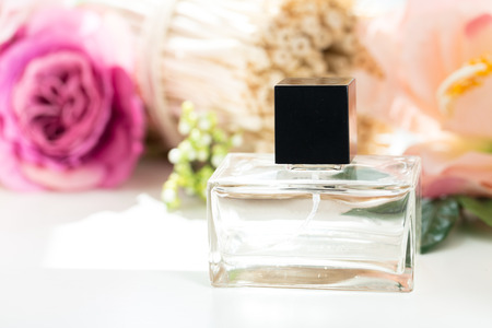 Perfume bottles with flowersの写真素材