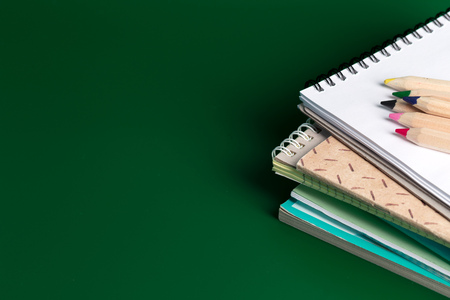 Note book and colored pencilsの写真素材