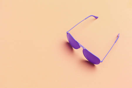 Flat lay fashion set: sunglasses on pastel backgrounds. Fashion summer is coming concept.の写真素材