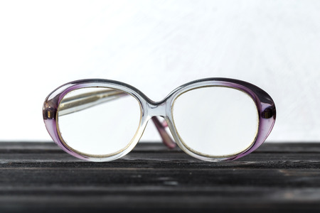 eyeglasses on wooden tableの写真素材