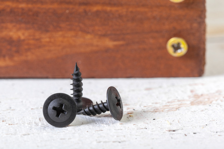 screws on a wooden table