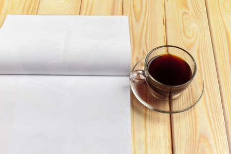 Mock-up magazine or catalog on a wooden table.